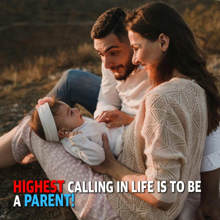 Couple with their baby outdoors during golden hour, gently holding and smiling at the infant.