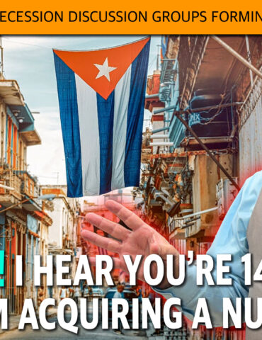 Cuban street scene with a large Cuban flag hanging between buildings; a man in a vest gestures toward the viewer beneath an orange banner.